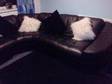10FT BLACK LEATHER CORNER SETTEE. The settee is 2 year....